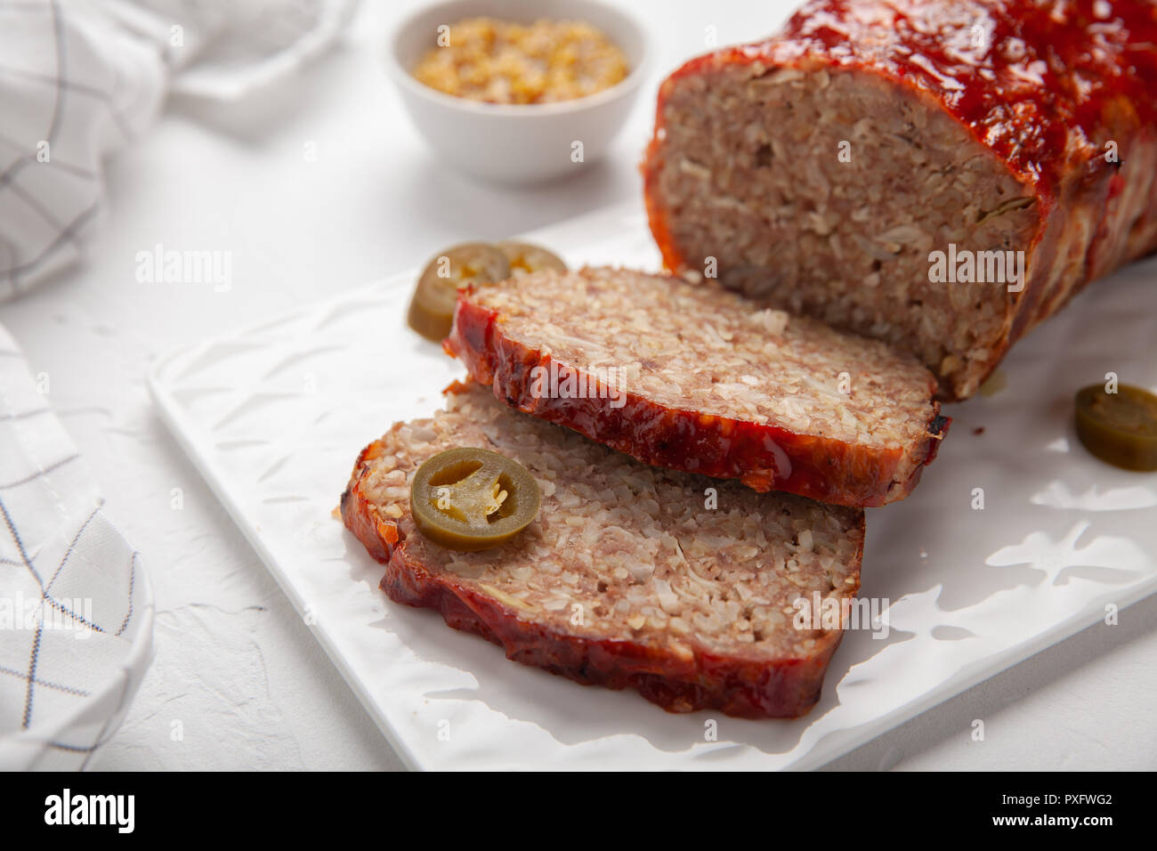 Bacon Wrapped Ground Beef Meatloaf with Cabbage and Bulgur Stock Photo