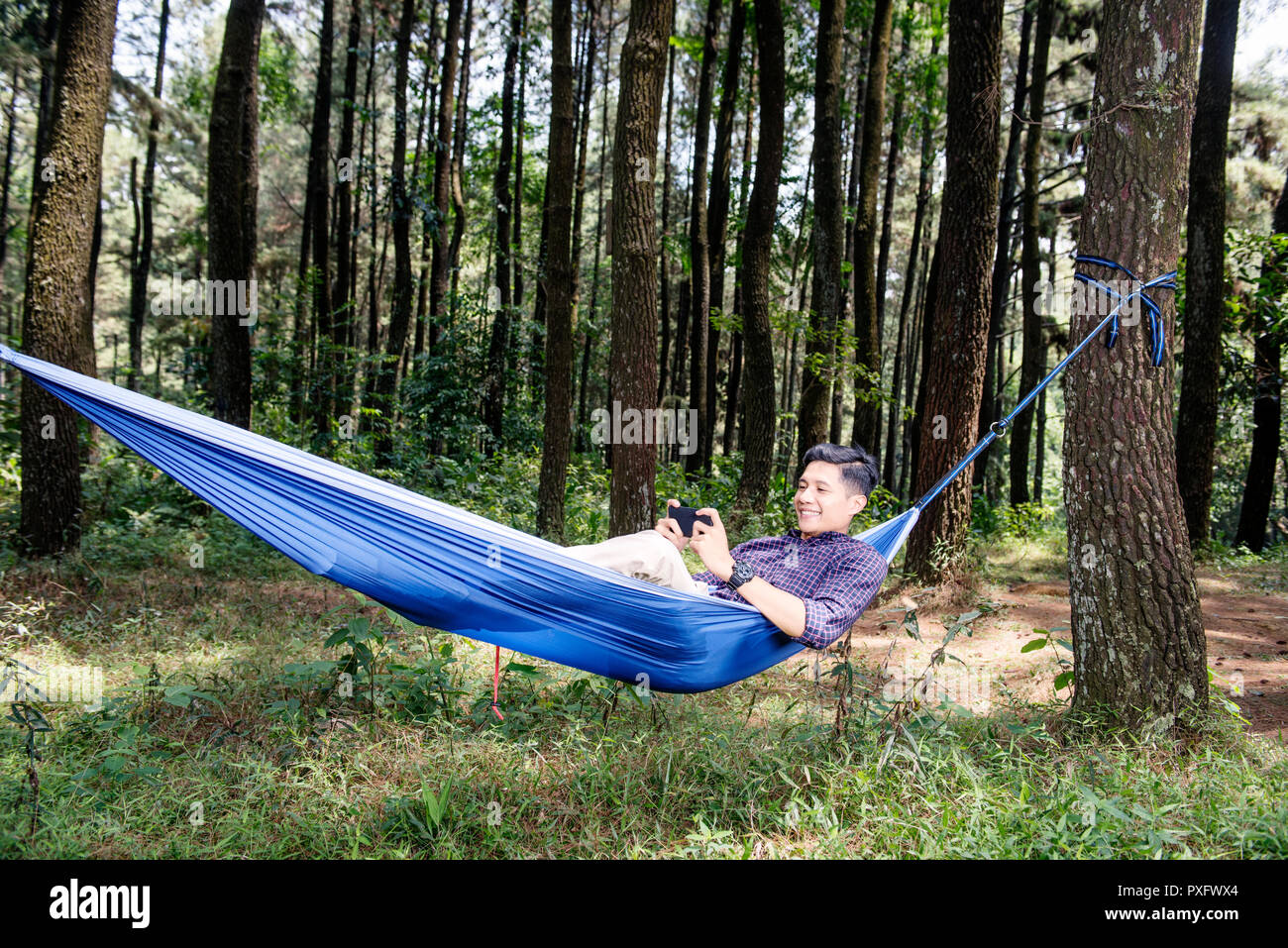 Man resting in hammock using hi-res stock photography and images - Alamy