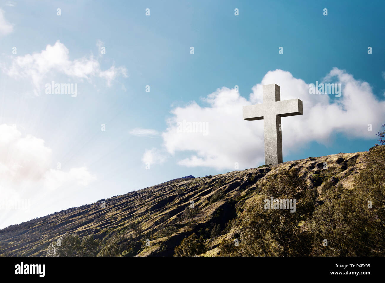 Cross of Jesus christ on hill with blue sky background Stock Photo - Alamy