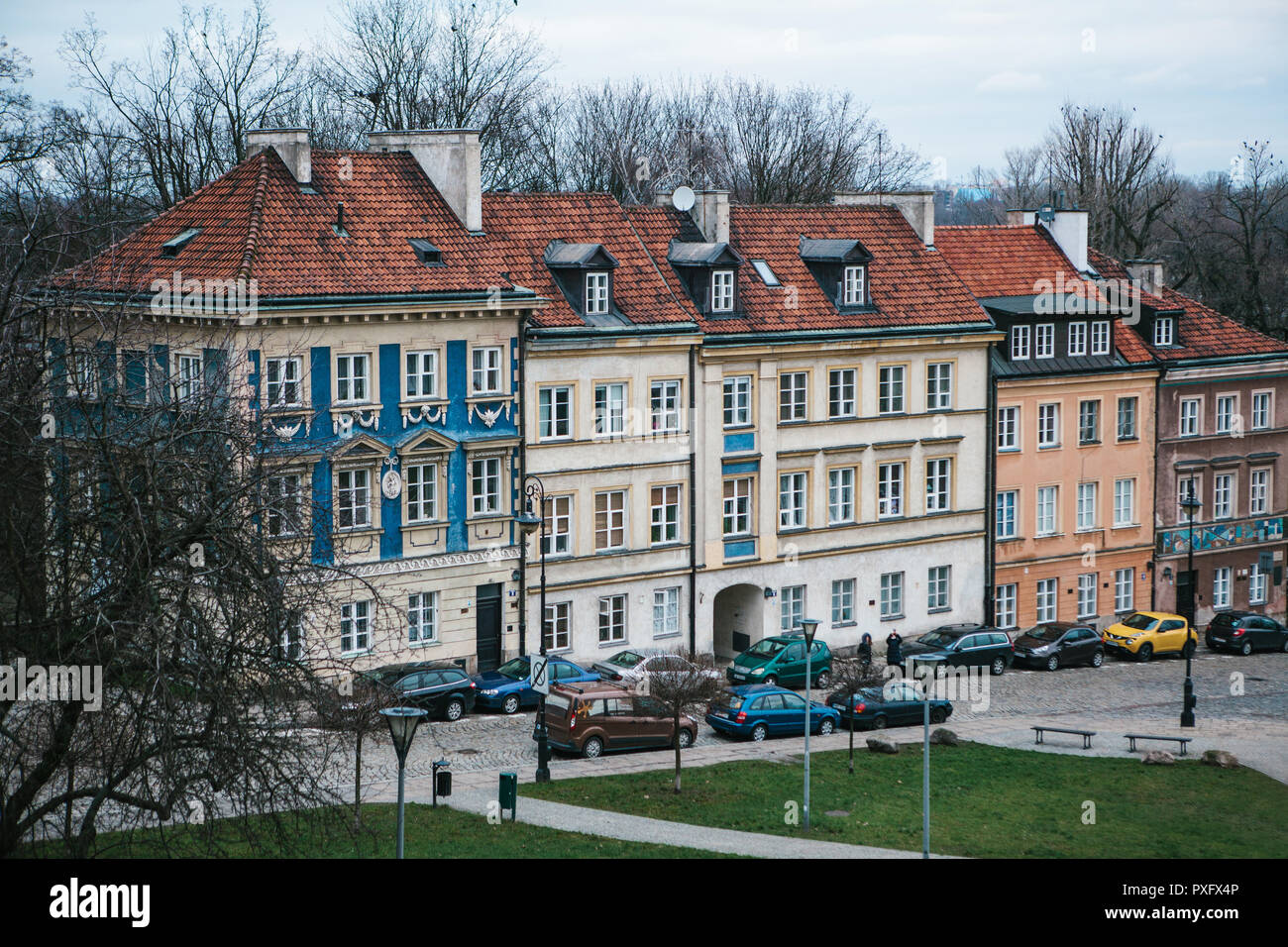 Beautiful street with traditional colorful houses in Warsaw in Poland. Near the houses are