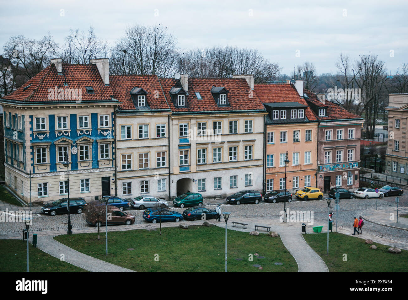 Beautiful street with traditional colorful houses in Warsaw in Poland. Near the houses are