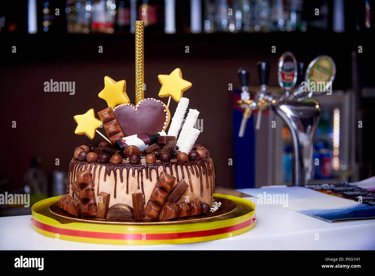 Chocolate Cake Decorated With Sweets Hearts Stars And A Bottle