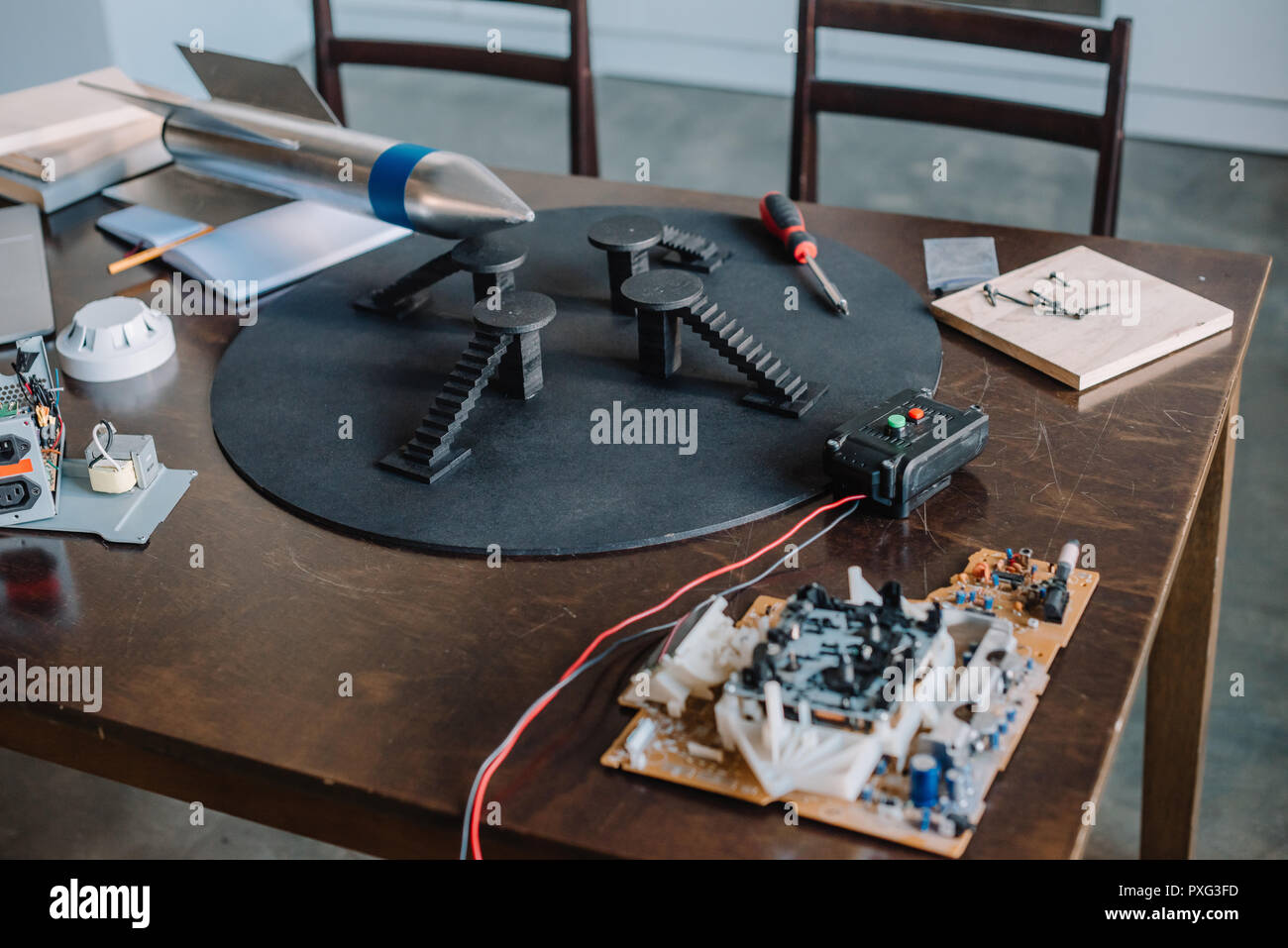 rocket model and tools for engineering on tabletop at home Stock Photo