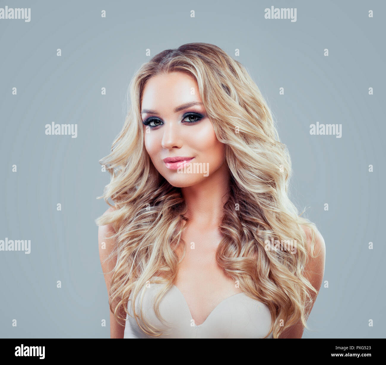 Smiling Woman With Blonde Wavy Hair And Makeup Stock Photo Alamy
