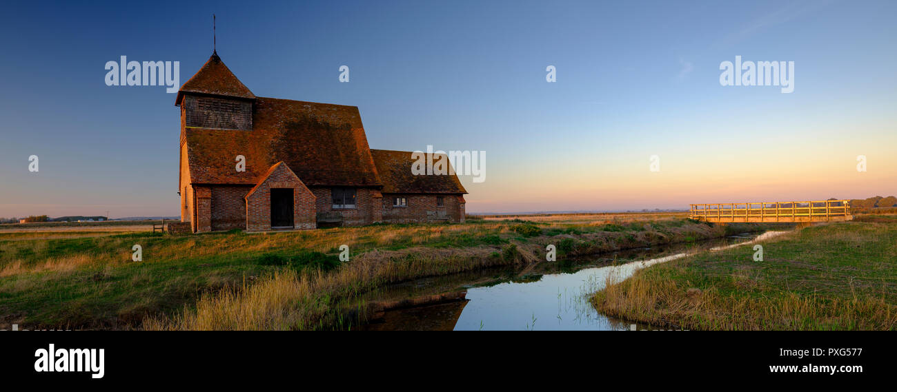 Autumnal clearing evening sunset over St Thomas a Becket Church, Fairfield, i the Romney Marsh, Kent, UK Stock Photo