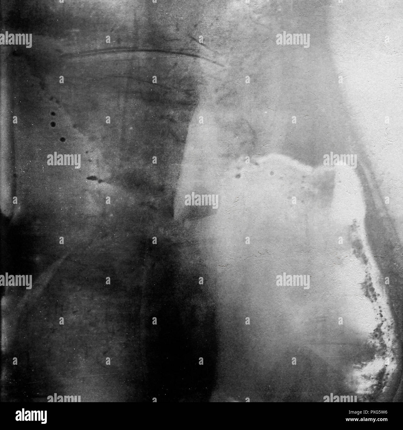 Black and white medium format film background with grain and light leak