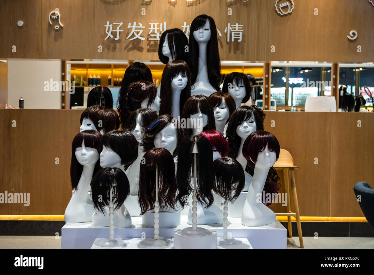 Hairstyles of Chinese women shown on wigs Stock Photo Alamy