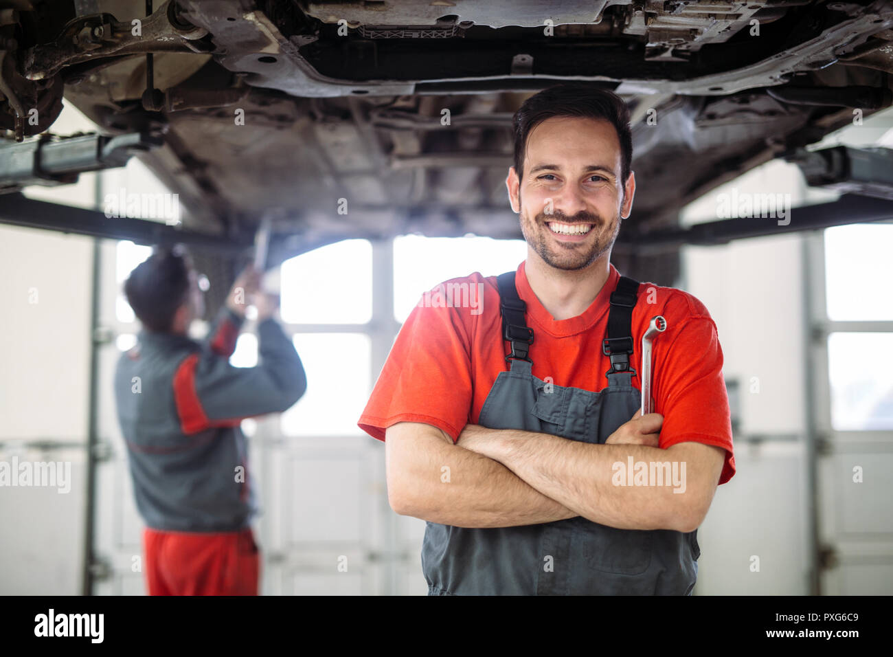 Technician in garage hires stock photography and images Alamy