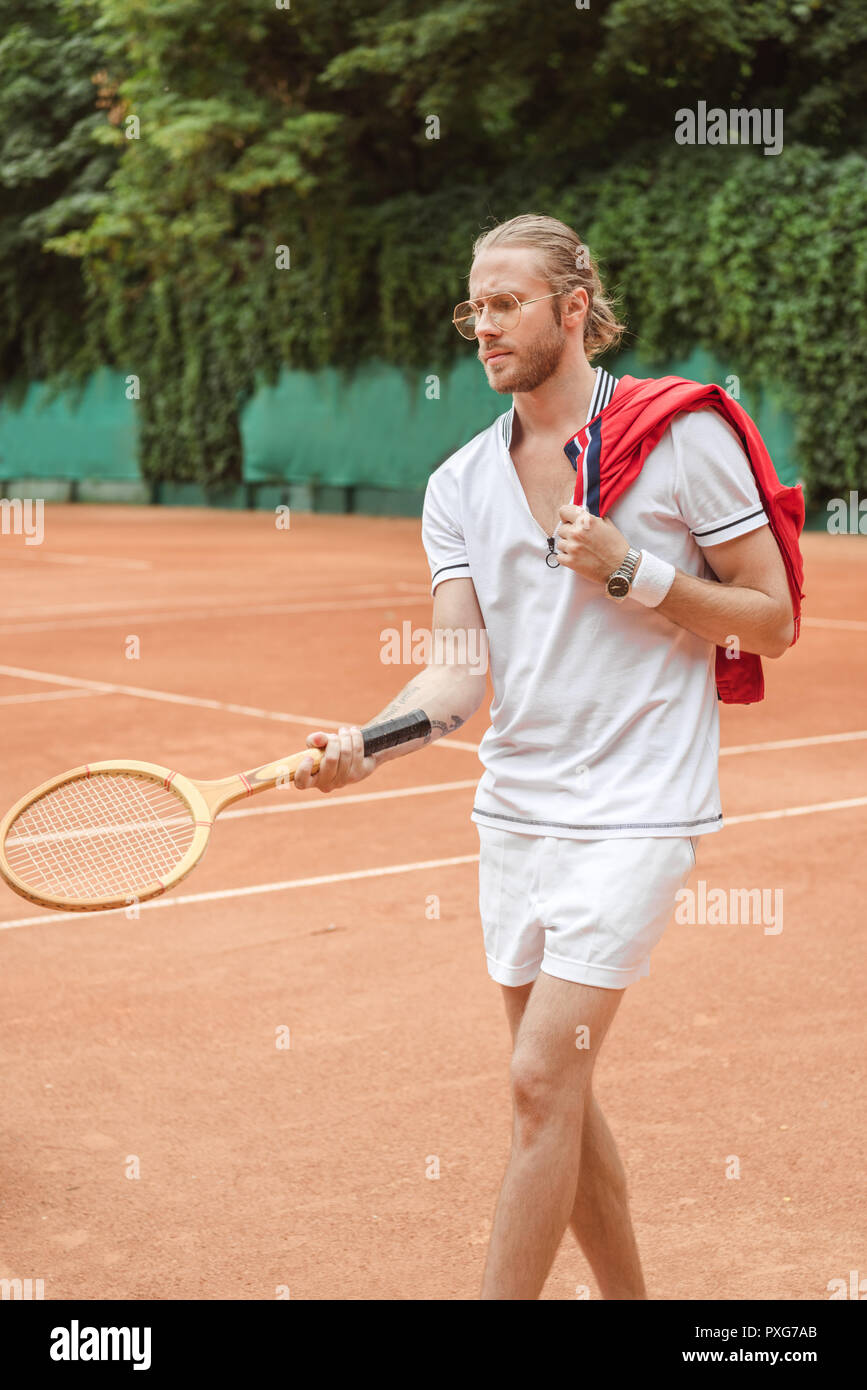 handsome tennis player with retro wooden racket on court Stock Photo ...