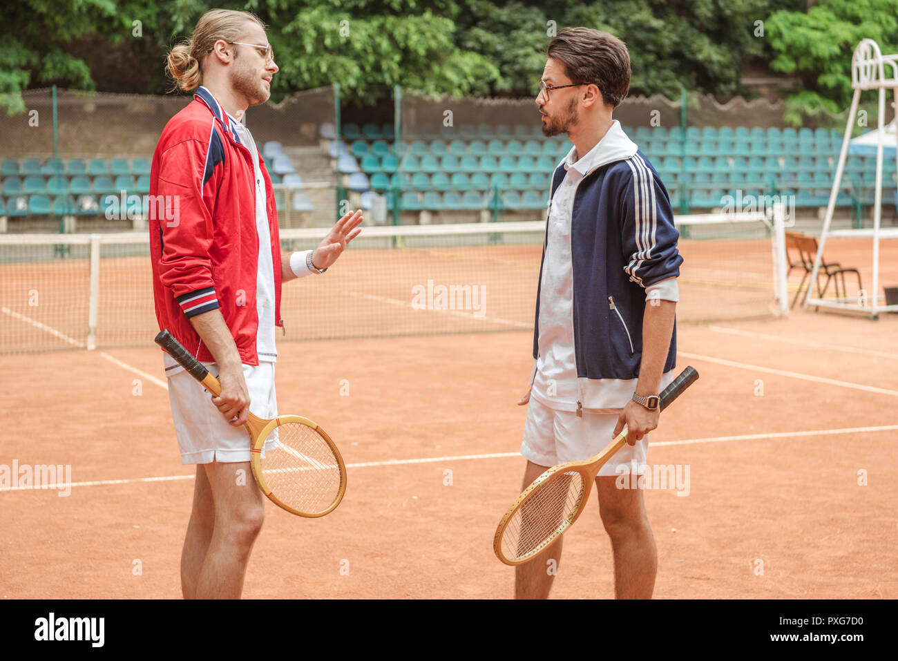 men with wooden rackets conflicting on tennis court Stock Photo Alamy
