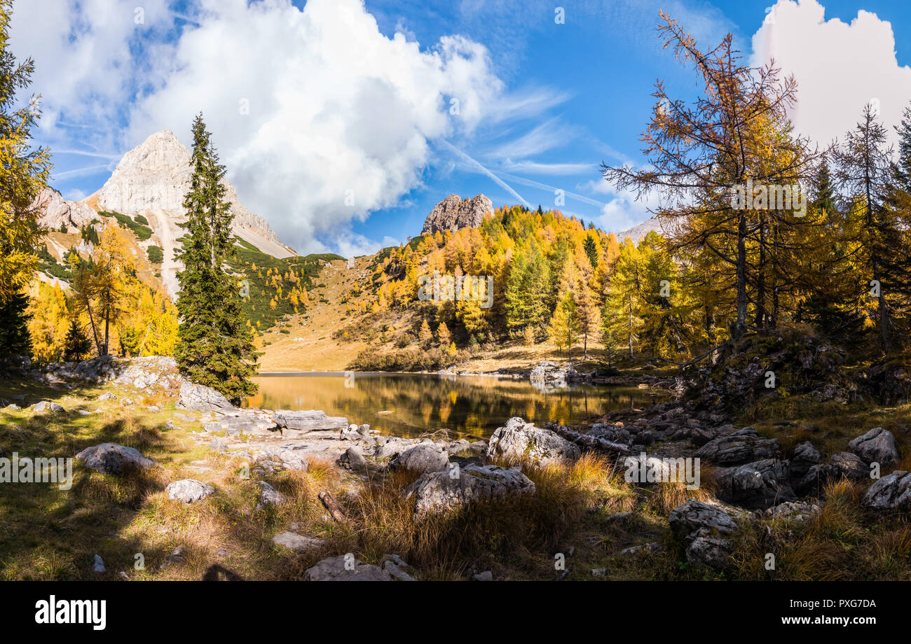 Colorful autumn morning in the mountains. Colourful autumn morning in mountain lake. Colorful autumn landscape. Lake of Borfaglia, Friuli, Italy. Stock Photo