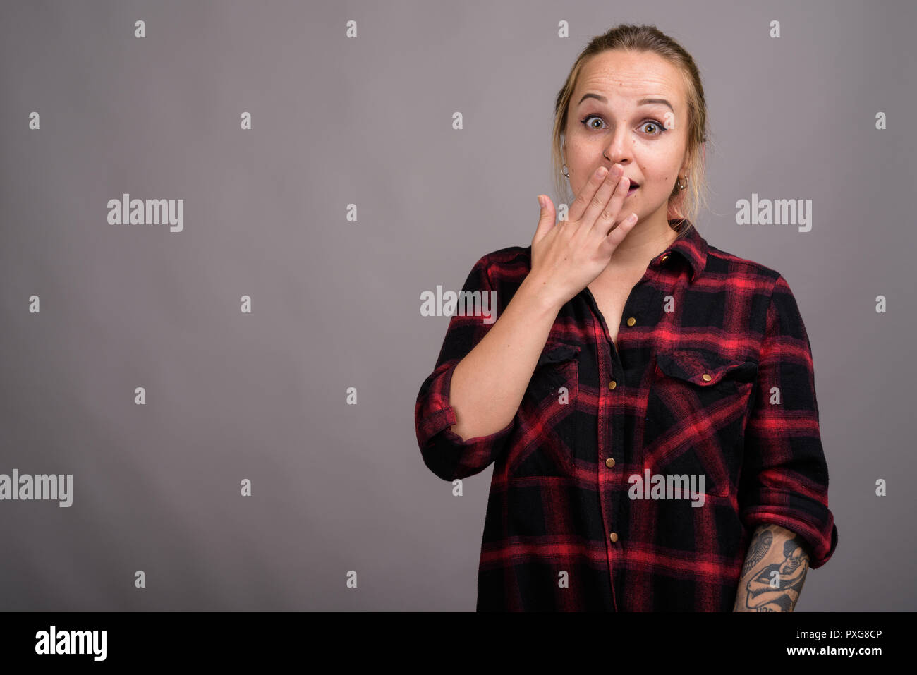 Surprised blond woman hi-res stock photography and images - Alamy