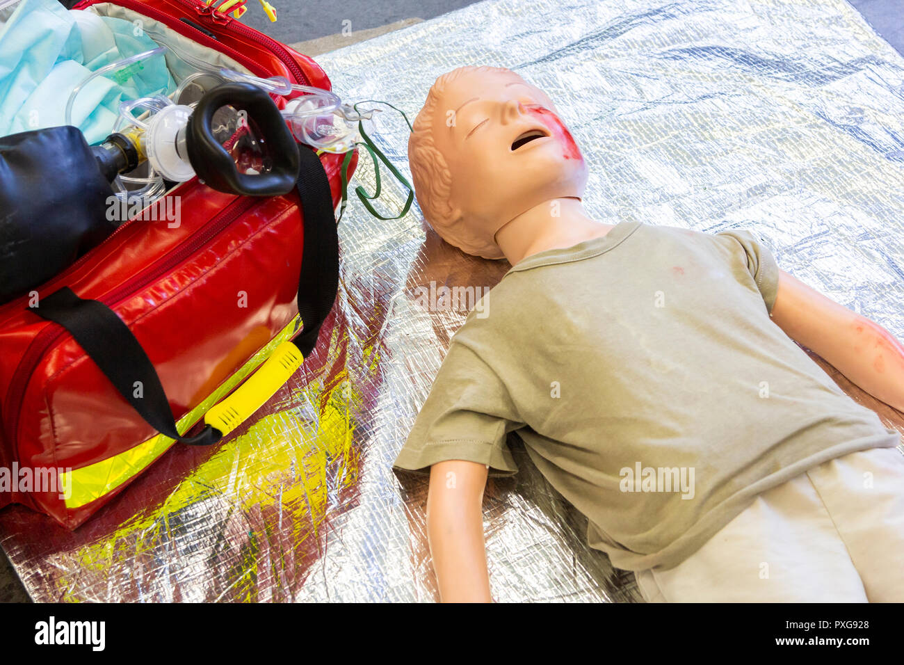 Medical teenager puppet lies injured on the ground Stock Photo - Alamy