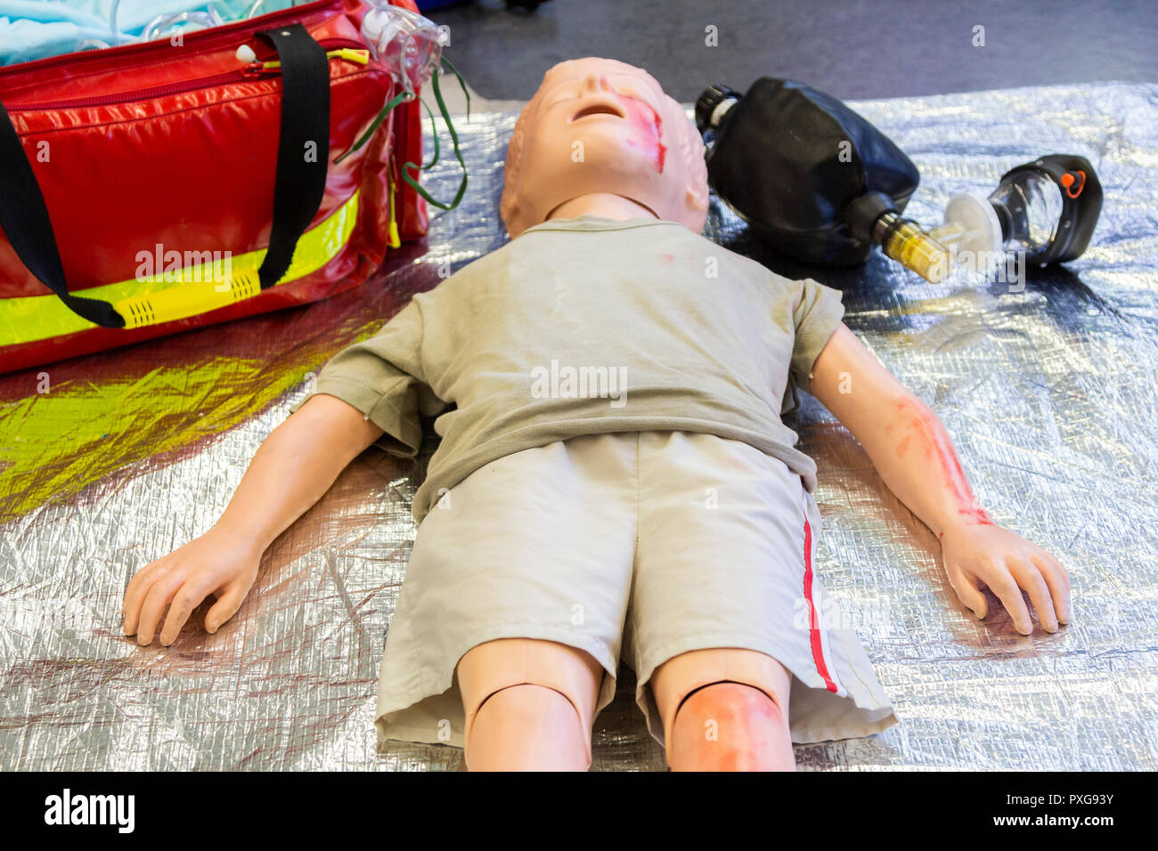 Medical teenager puppet lies injured on the ground Stock Photo - Alamy