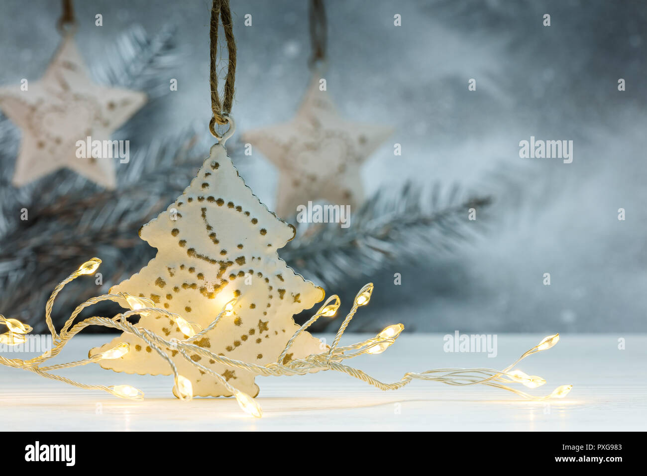 christmas decorations and garlands. silver background with blurred fir ...