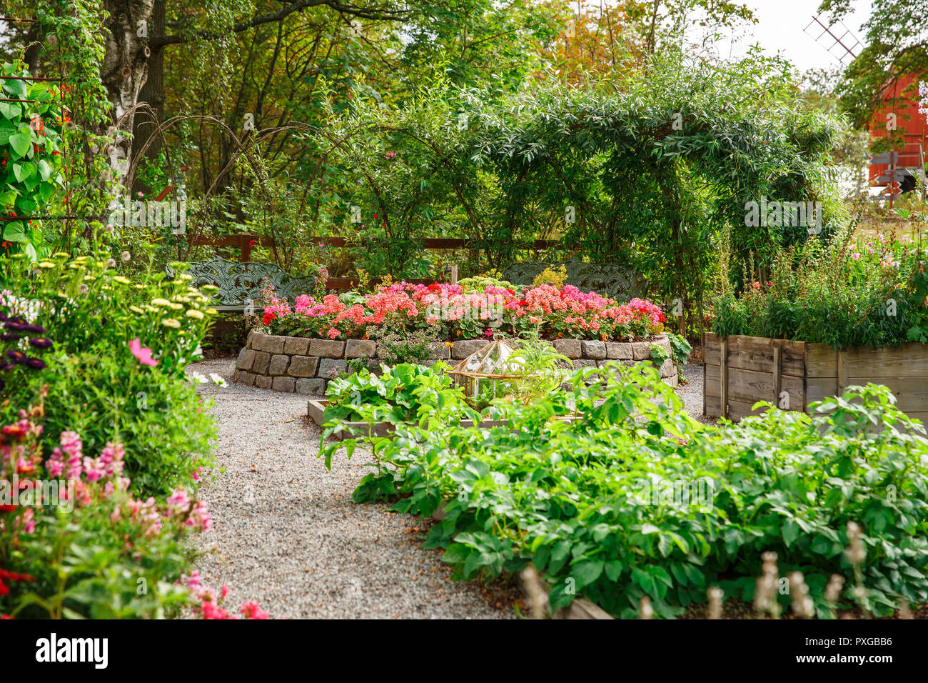 Vegetable and flower garden in sunny summer day. Stock Photo