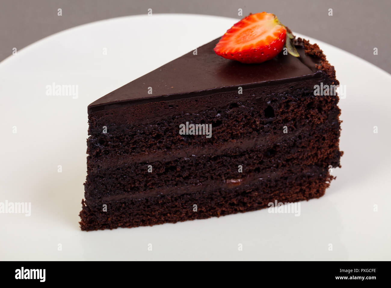 Sweet Chocolate cake with strawberry Stock Photo - Alamy