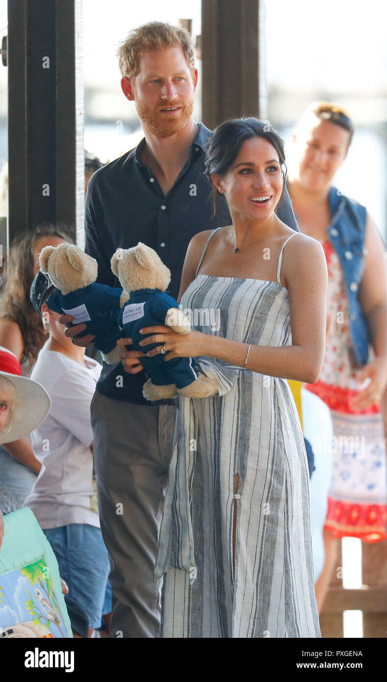 The Duke and Duchess of Sussex walk receive two teddy bears from members of the public on Kingfisher Bay Jetty during their visit to Fraser Island, Queensland, on day seven of the Duke and Duchess of Sussex's visit to Australia. Stock Photo