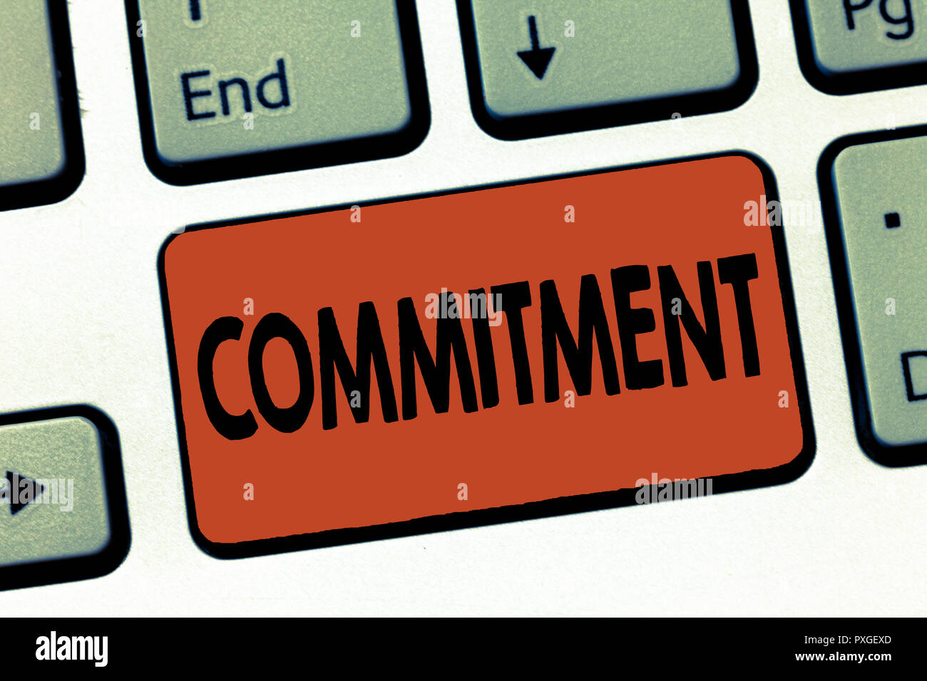Text sign showing Commitment. Conceptual photo Quality of being dedicated to cause activity Engagement. Stock Photo