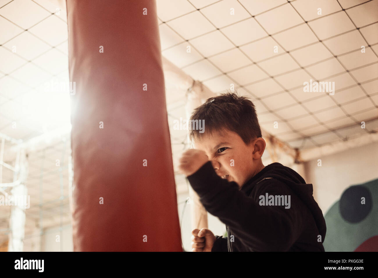 Close up little boy boxing and looking fierse Stock Photo