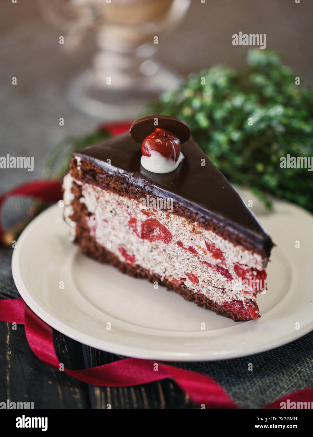 A piece of chocolate cake with cherries Stock Photo
