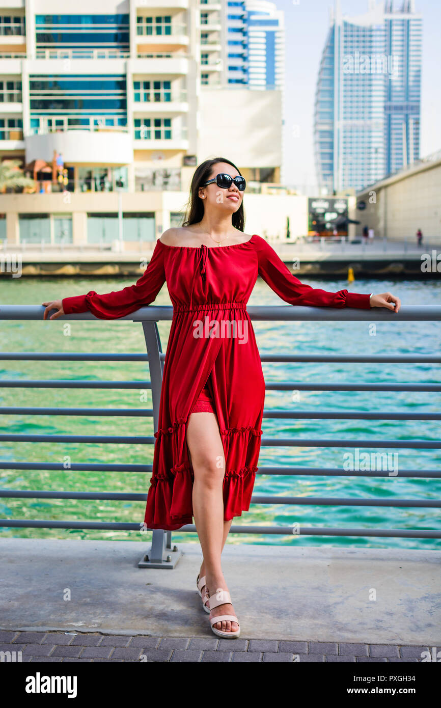 Fashionable girl enjoying a day at Dubai marina, UAE Stock Photo