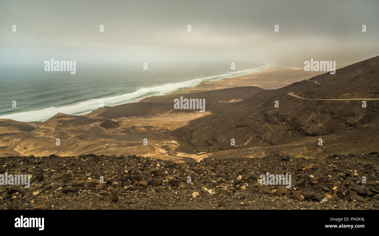 Dirt road along ridge of hills along coast of Cofete, Fuerteventura, Canary Islands, Spain. Stock Photo