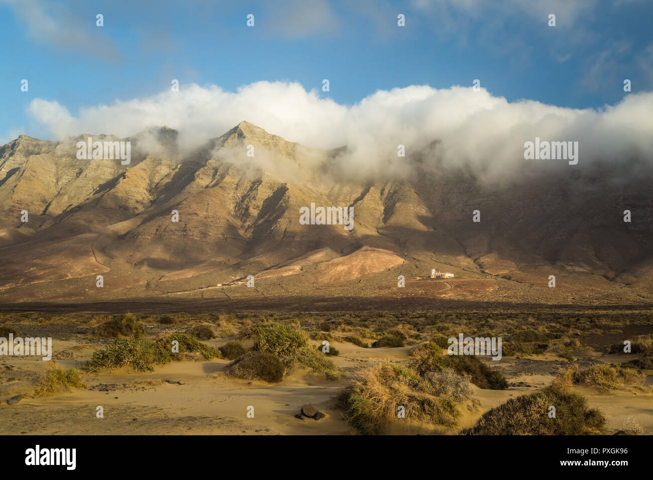 Cloudy mountain range in Cofete, south of Fuerteventura. Stock Photo