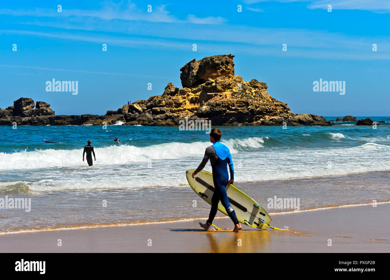 Surfer at the Praia do Castelejo beach at the Costa Vicentina coast, Vila do Bispo, Portugal Stock Photo