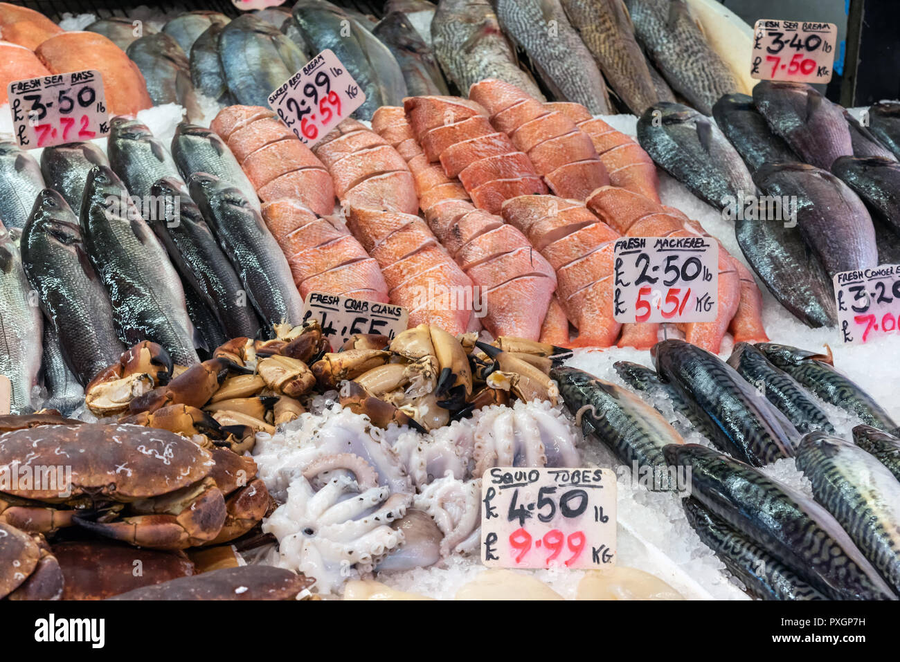 Crabs, fish and seafood for sale at a market in London Stock Photo