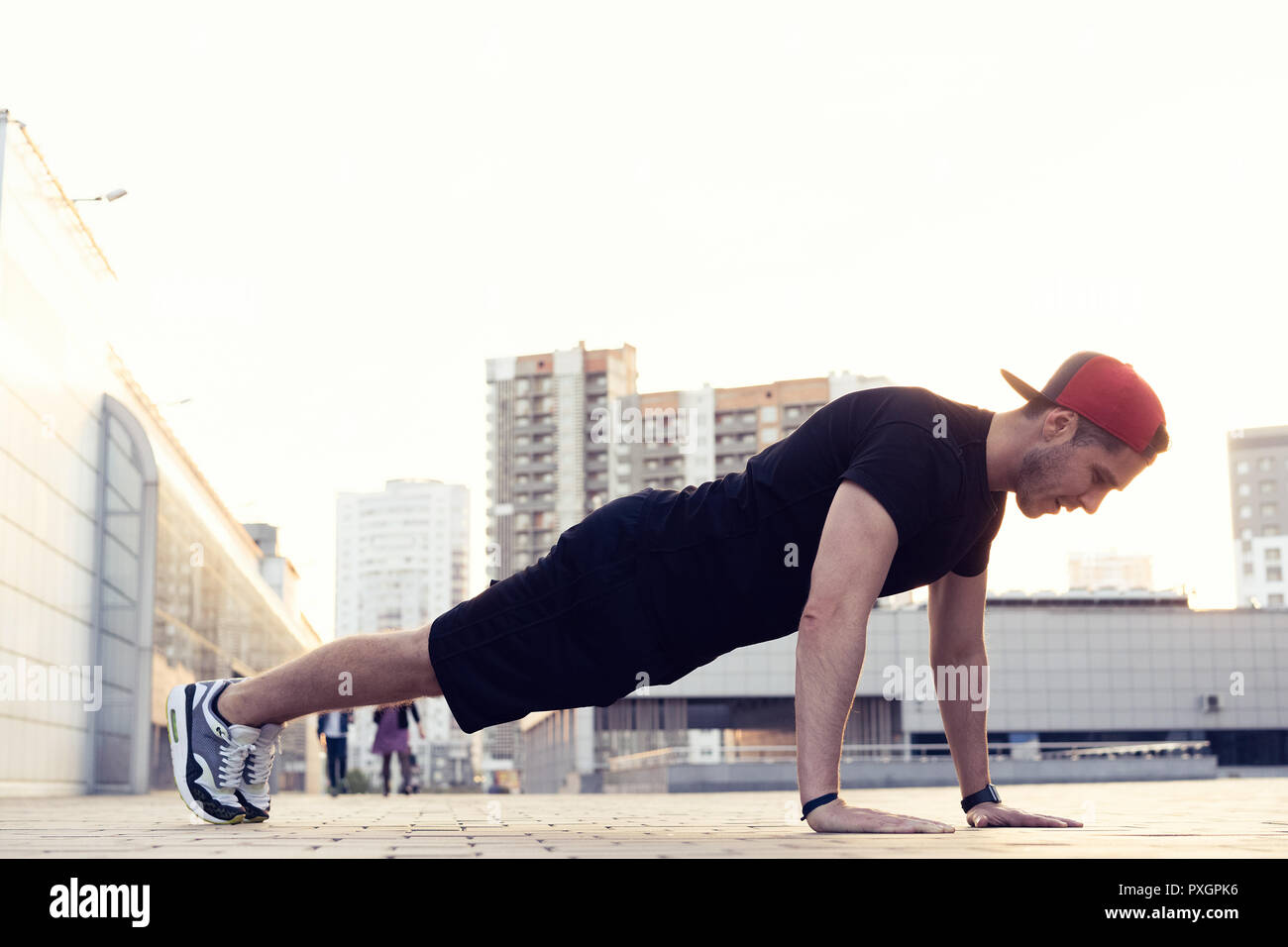 Picture of a young athletic man doing push ups outdoors.Fitness and ...