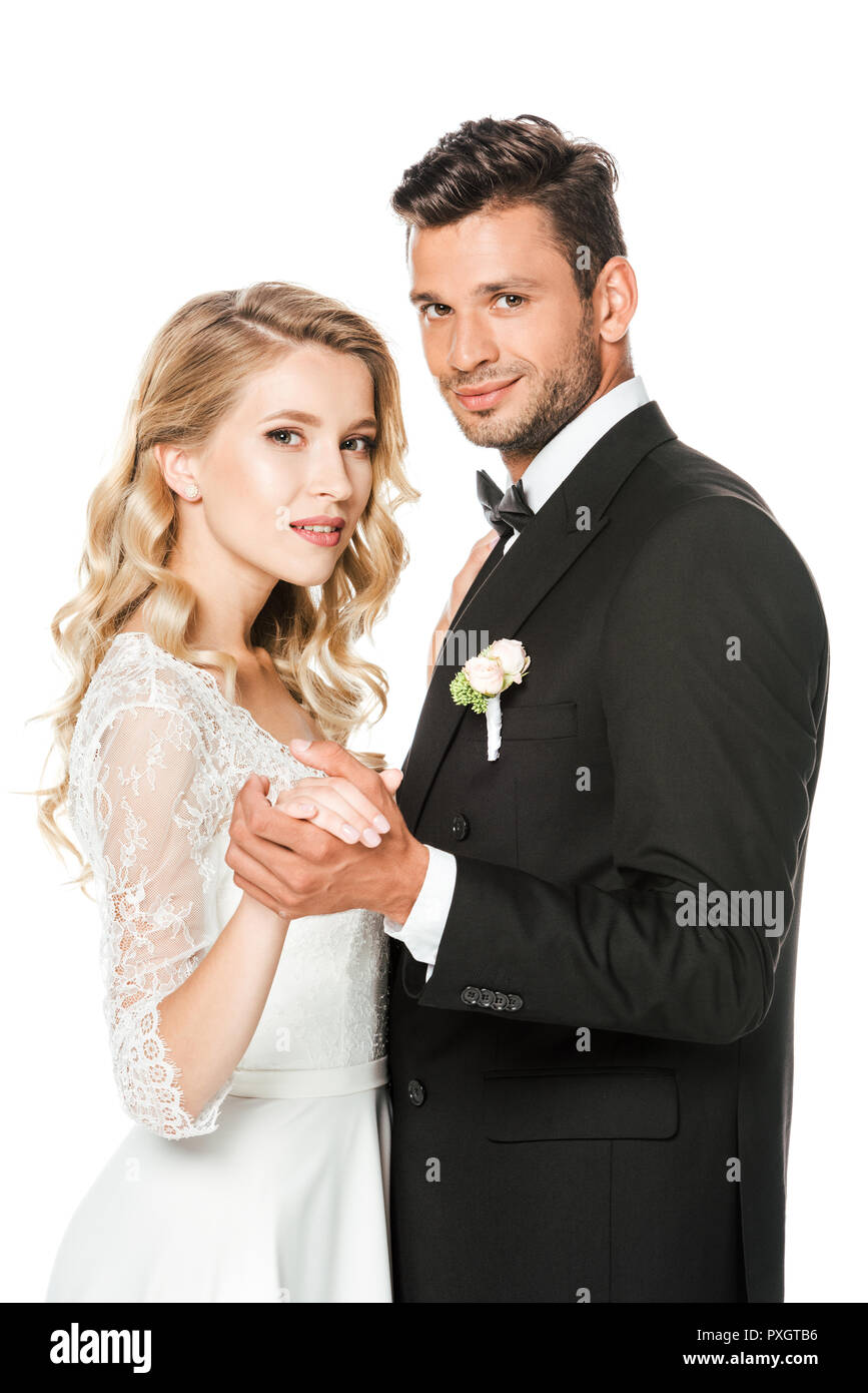 smiling young bride and groom dancing isolated on white Stock Photo - Alamy