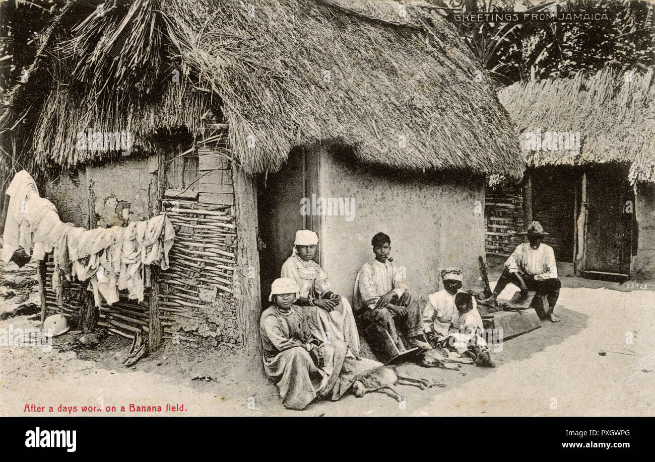 Jamaica - Villagers resting outside house after day's work Stock Photo