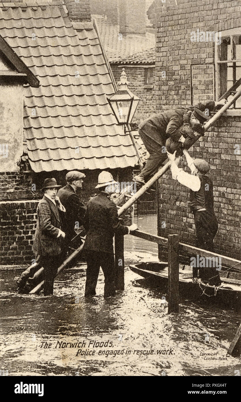 Police rescue a small boy during the Floods in Norwich Stock Photo
