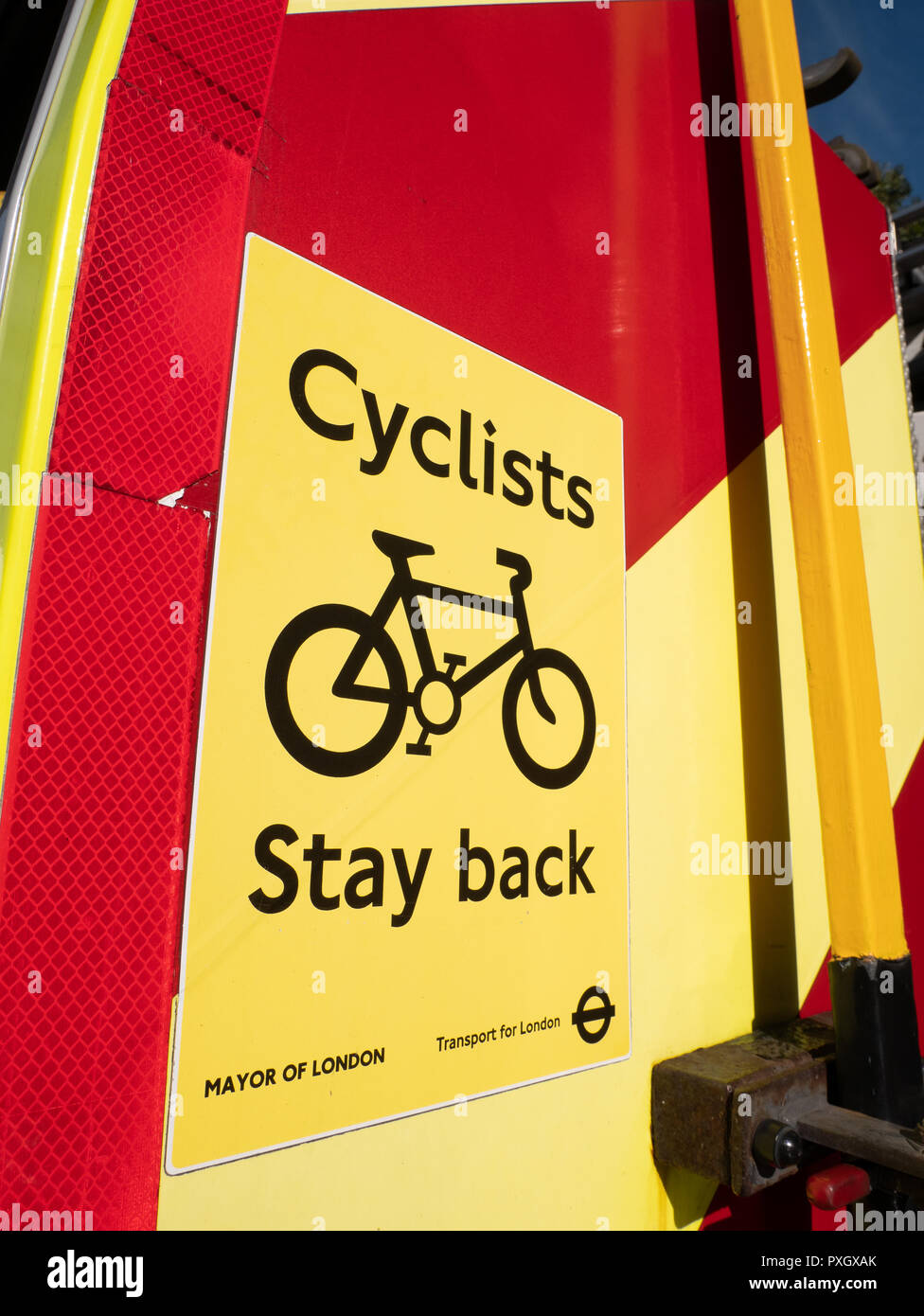 Cyclists Stay Back warning sign on rear of fire engine Stock Photo