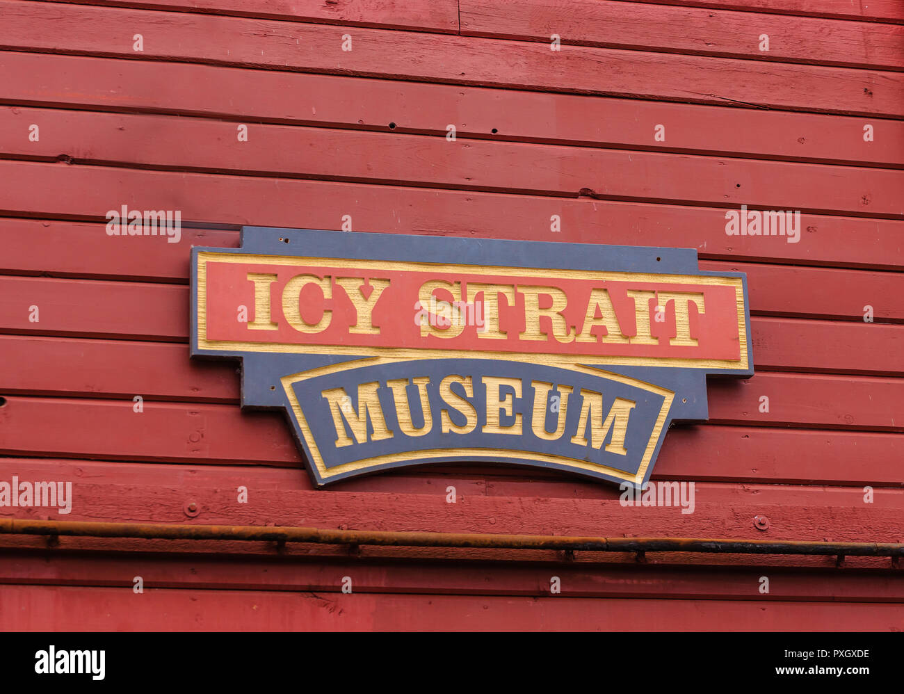Icy Strait Museum sign on Red Wood Wall Stock Photo - Alamy