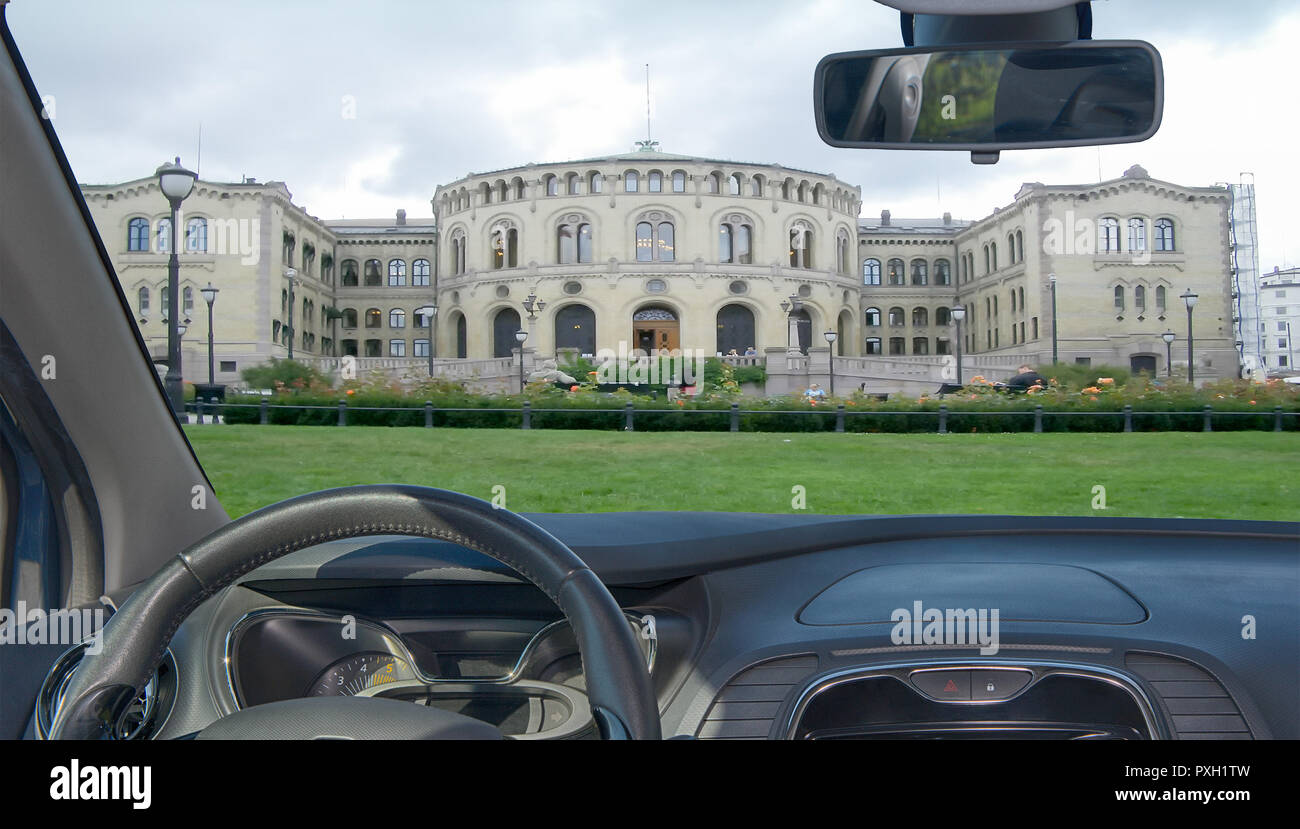 Looking through a car windshield with view of the facade of the Norwegian Parliament in Oslo, Norway Stock Photo