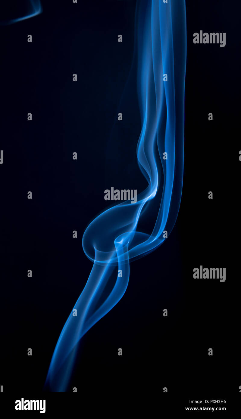 Abstract blue smoke swirls on dark background Stock Photo - Alamy
