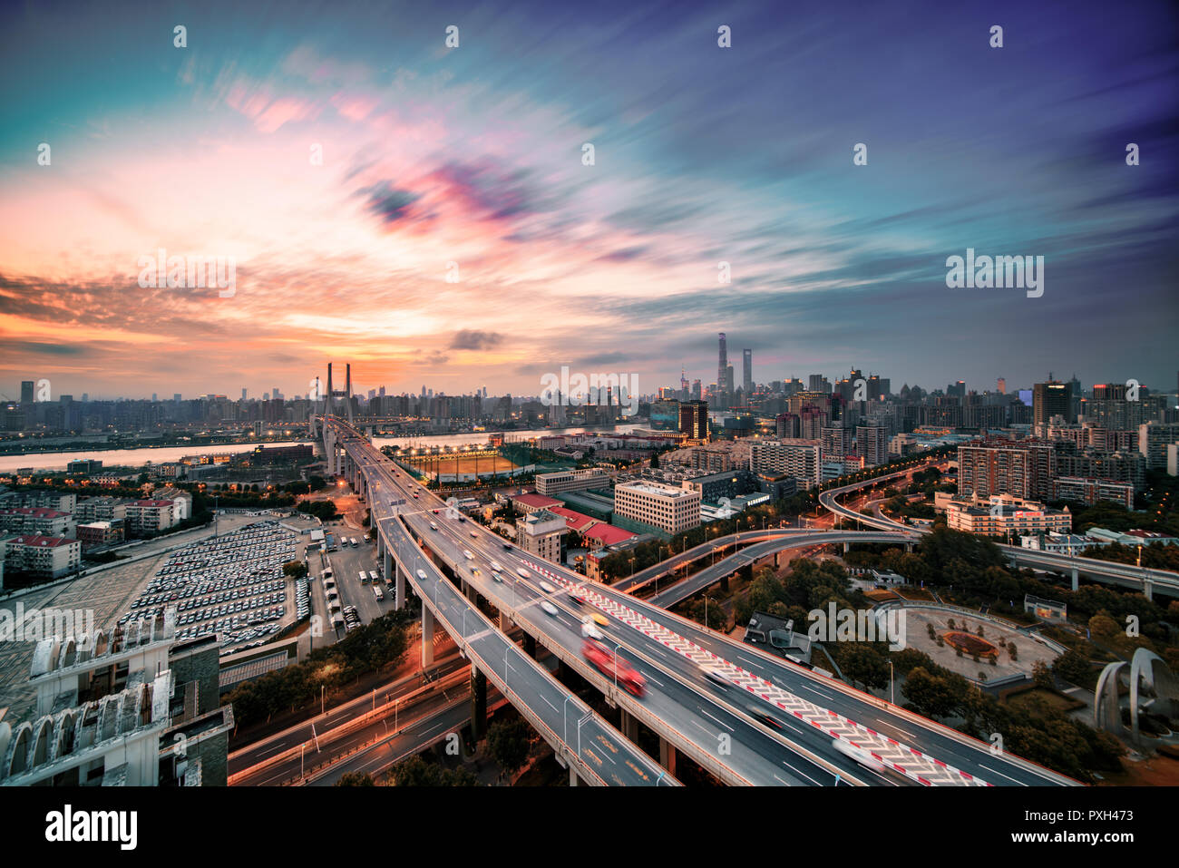 The Traffic light trail on the freeway and the City with the magic ...