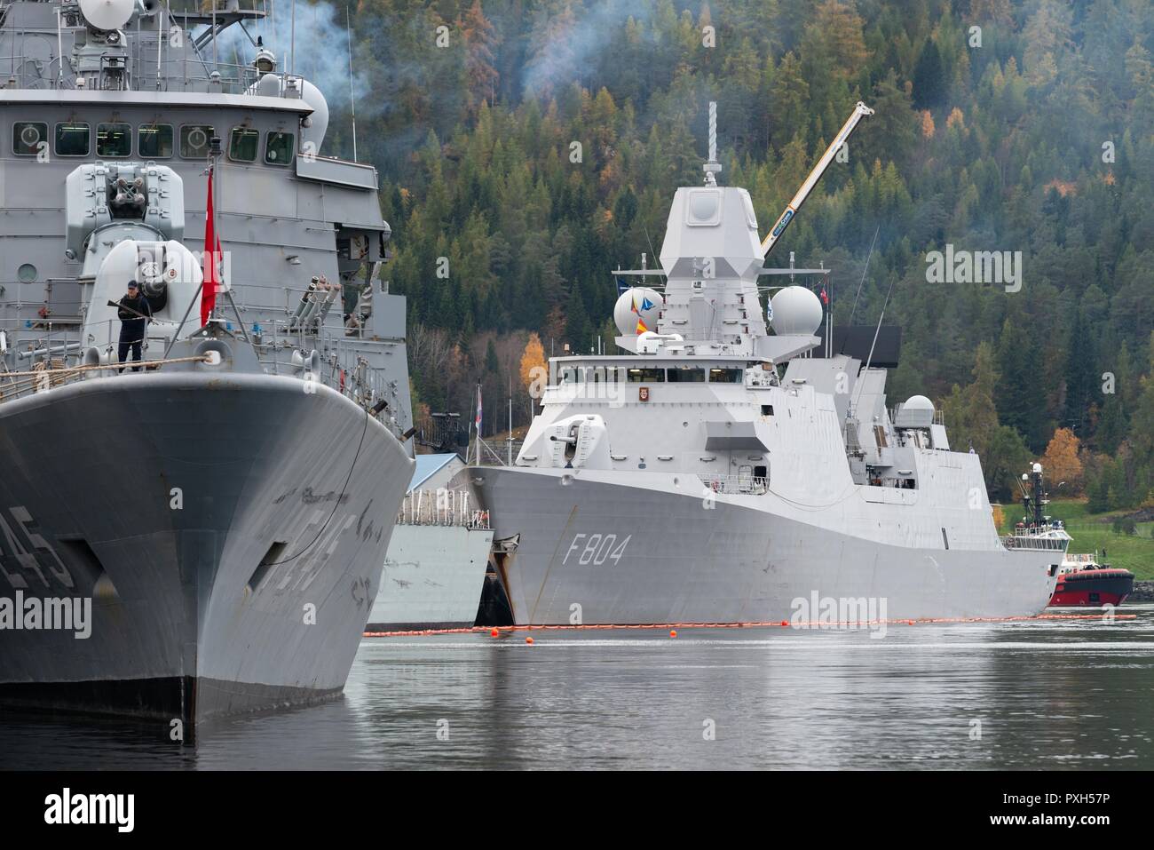 Trondheim (NORWAY) , Oct. 21. 2018. Standing NATO Maritme Group Two (SNMG2) ships, TCG Orucreis (F245) and flagship HNLMS De Ruyter (F804) are berthed alongside in Trondheim harbour prior their participation to NATO exercise Trident Juncture 2018. Trident Juncture 18 is designed to ensure that NATO forces are trained, able to operate together and ready to respond to any threat from any direction. Trident Juncture 18 takes place in Norway and the surrounding areas of the North Atlantic and the Baltic Sea, including Iceland and the airspace of Finland and Sweden.     With more than 50,000 partic Stock Photo