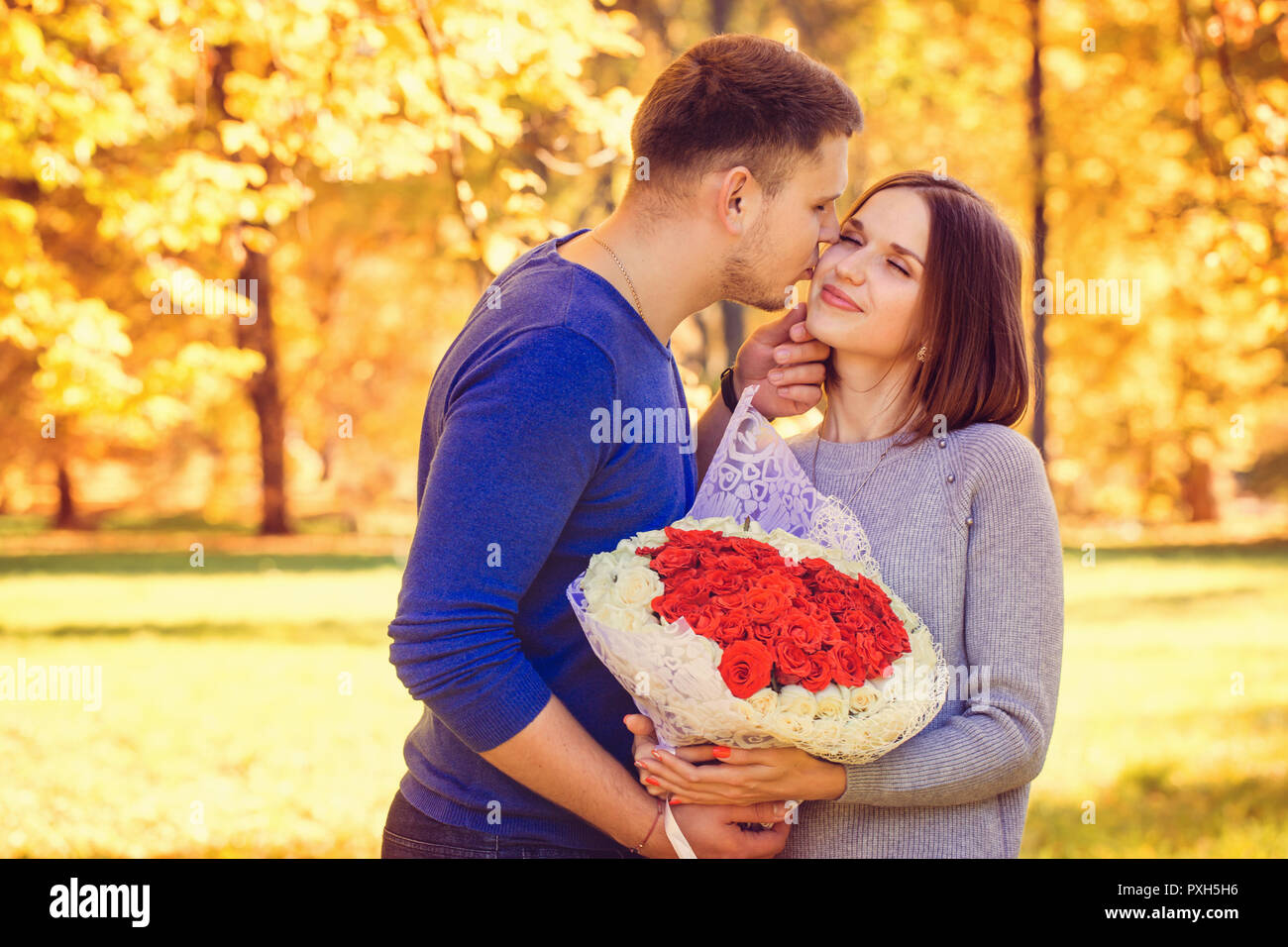 man kisses woman Stock Photo - Alamy