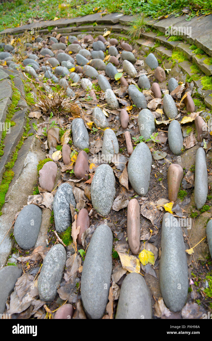 Huge Large Stones And Pebbles As Decorative Bent Path Or Flower