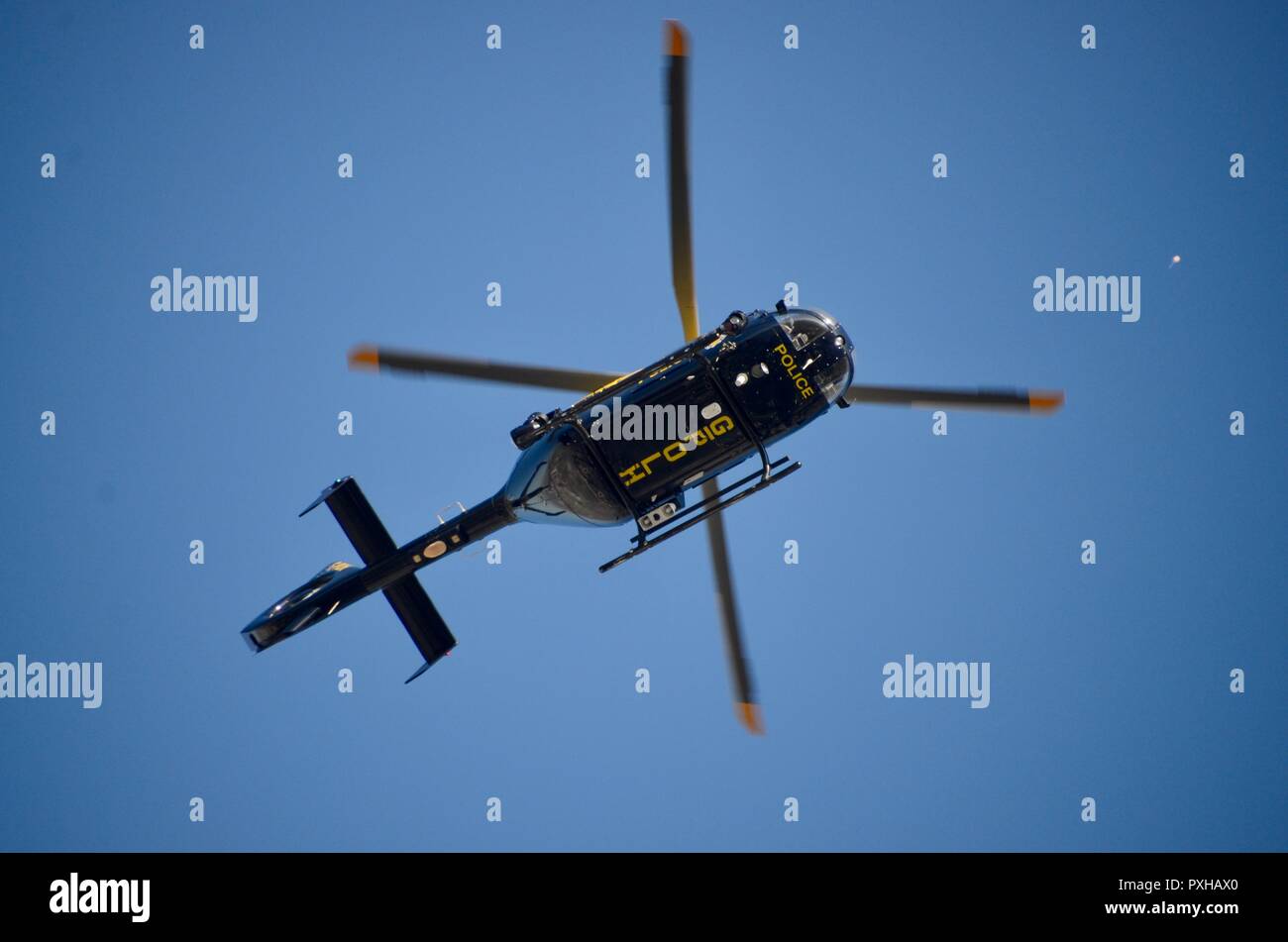 National Police Air Service eurocopter ec145 over london skies watching a demonstration Stock Photo