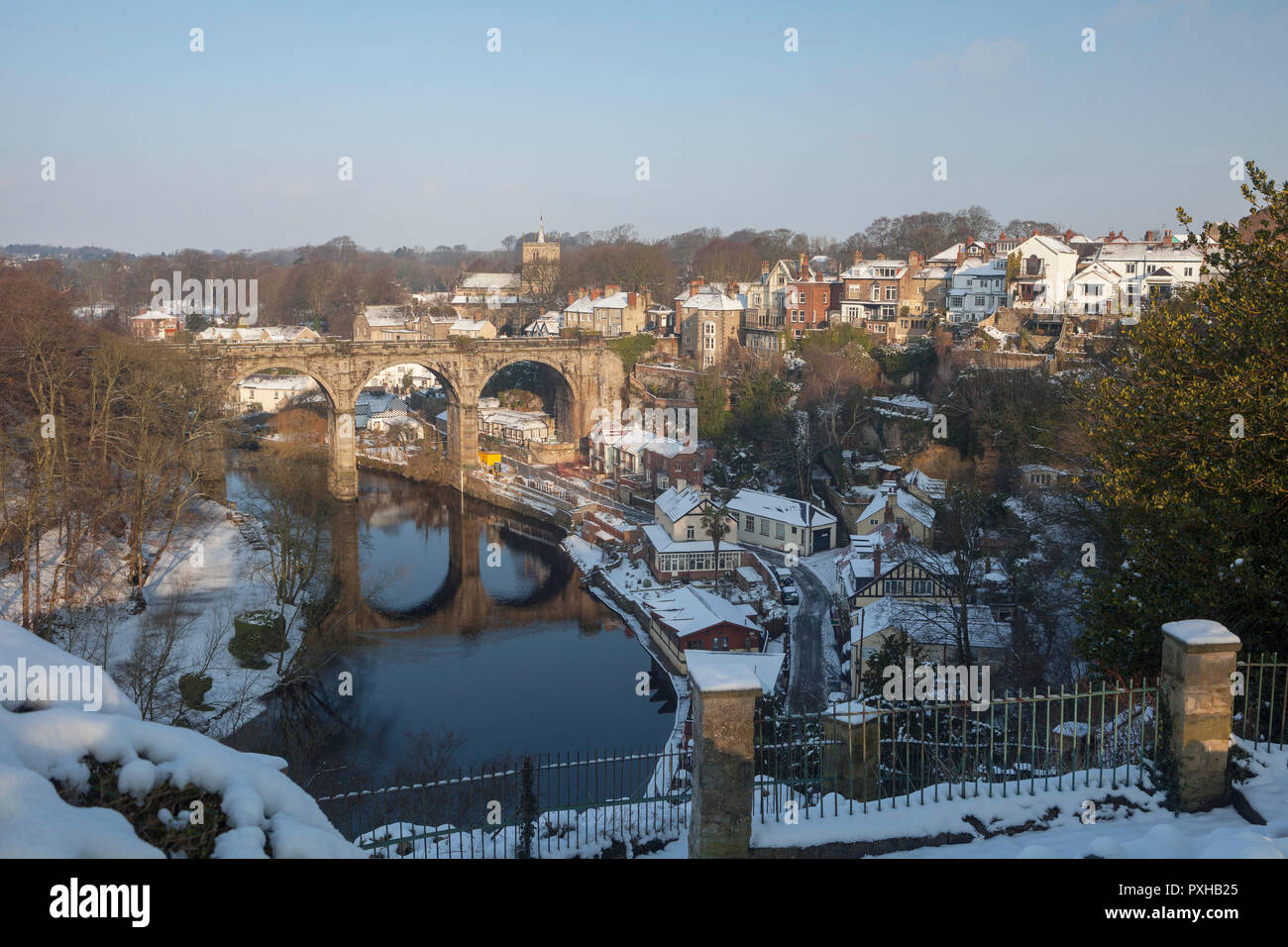 Snowy winter view of the town of Knaresborough in North Yorkshire showing the railway Viaduct and River Nidd Stock Photo