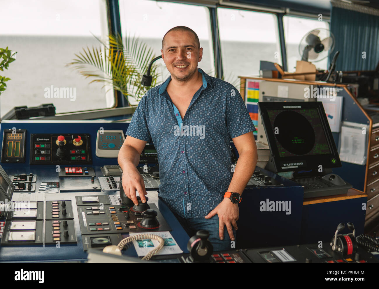 Marine navigational officer or chief mate on navigation watch Stock