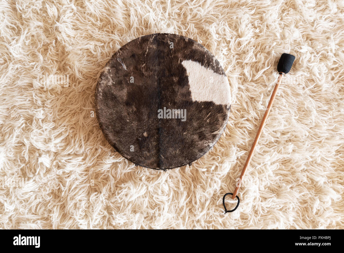 Traditional drum on white carpet Stock Photo