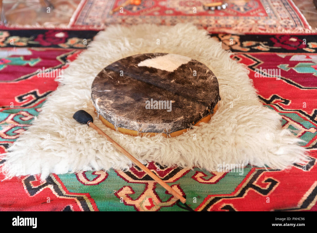 Traditional drum on white carpet Stock Photo