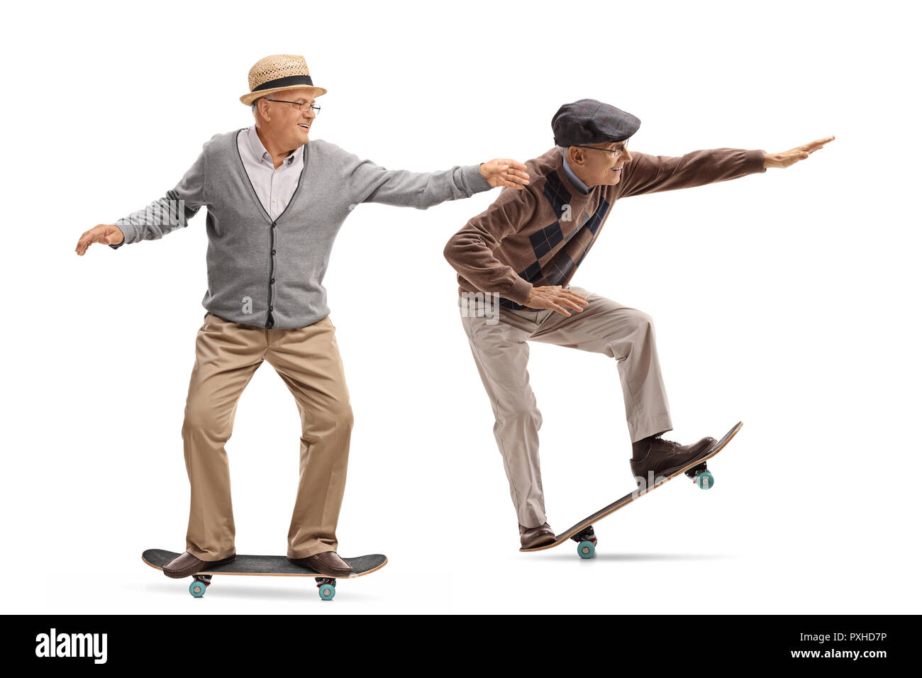 Full length profile shot of two elderly men skateboarding isolated on white  background Stock Photo - Alamy