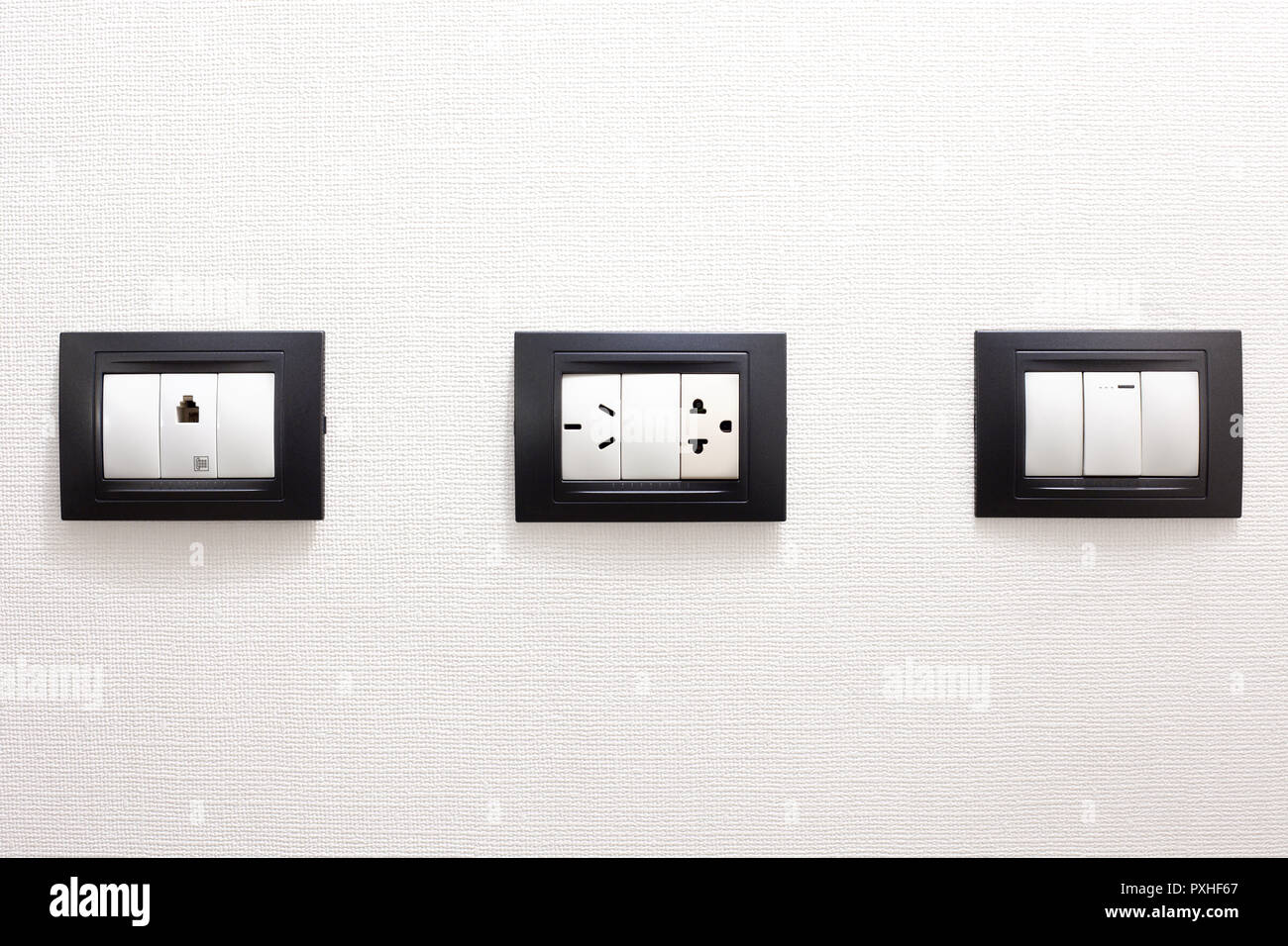 Electrical outlets on a white wall Stock Photo Alamy