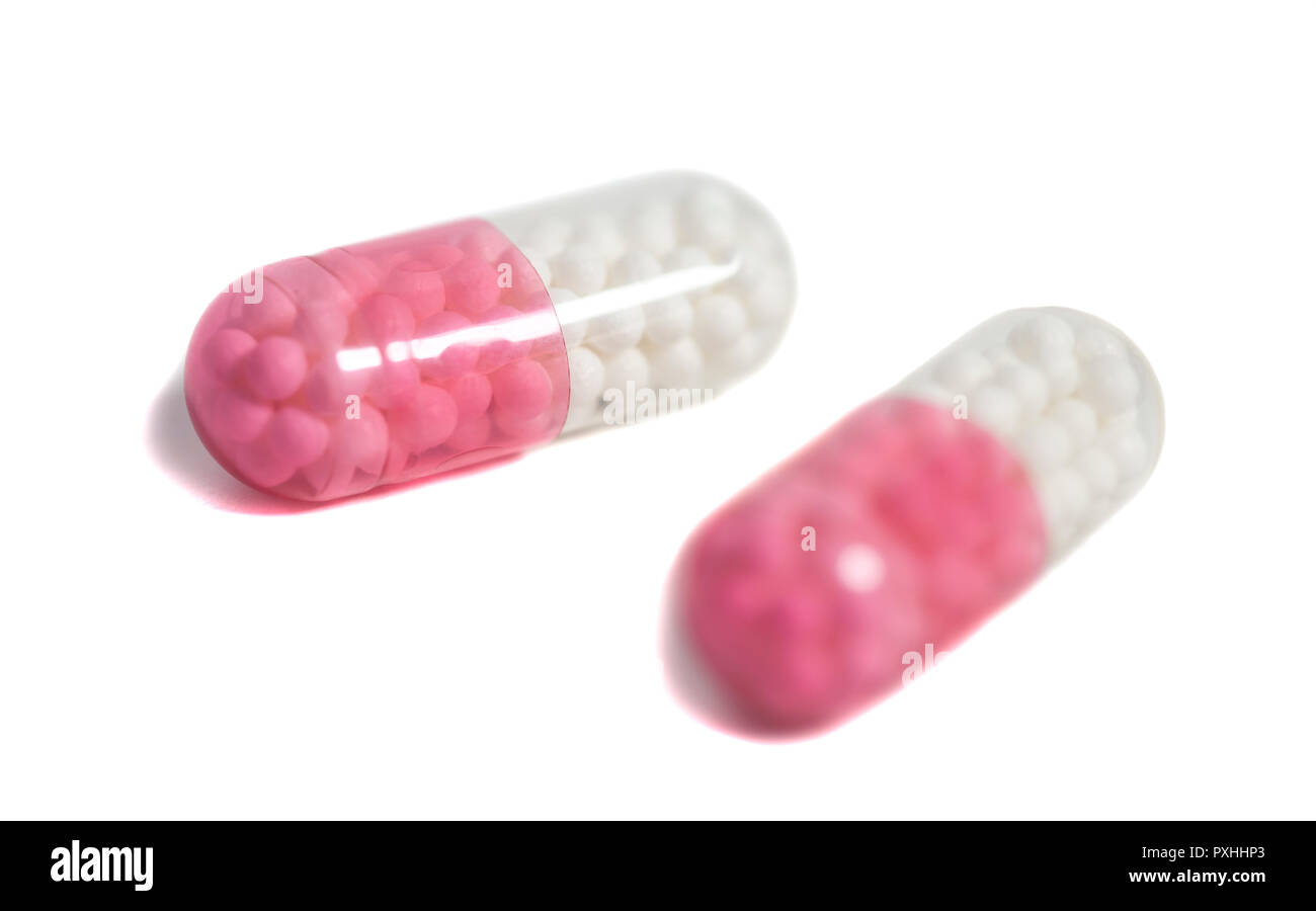 Red and white pills Stock Photo